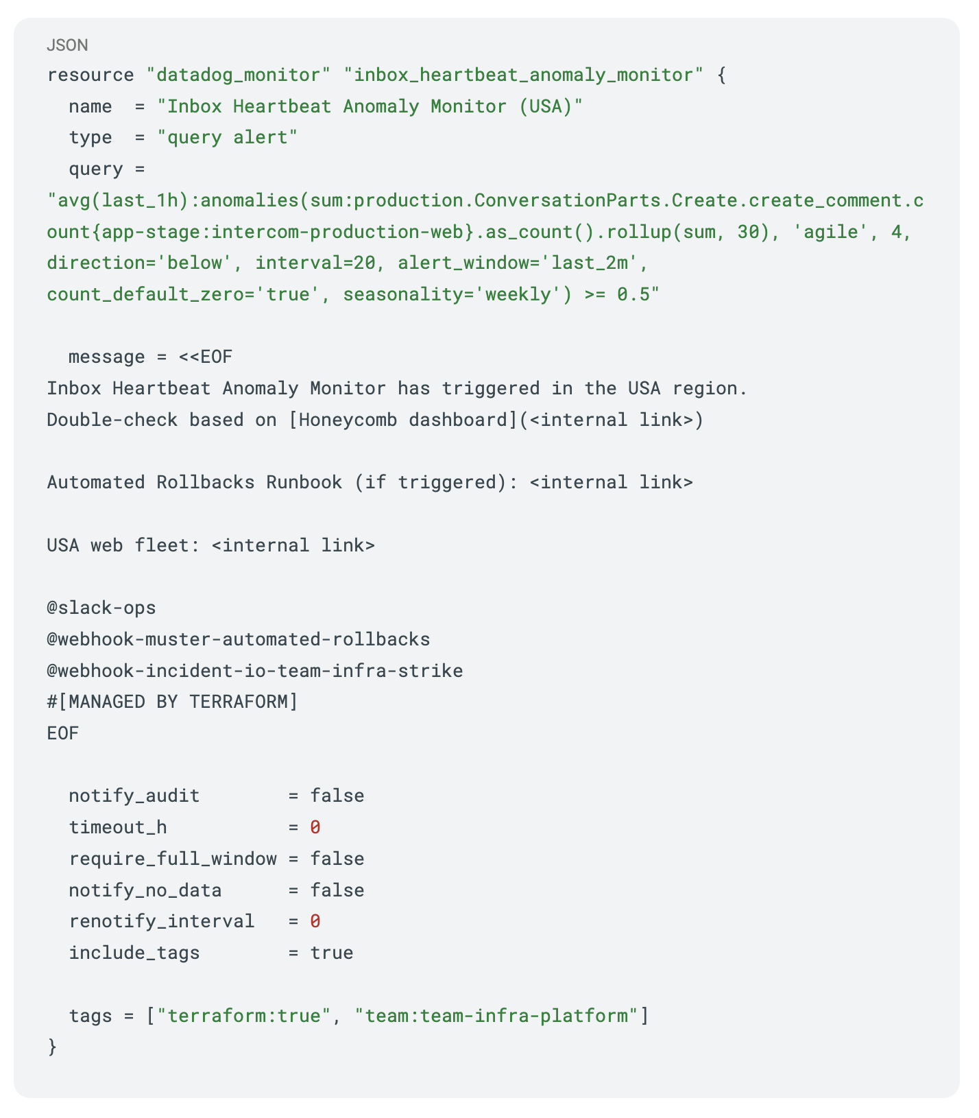 Terraform configuration for a Datadog query alert titled 'Inbox Heartbeat Anomaly Monitor (USA)', using anomalies() on production events with Slack and webhook notifications plus team tags.