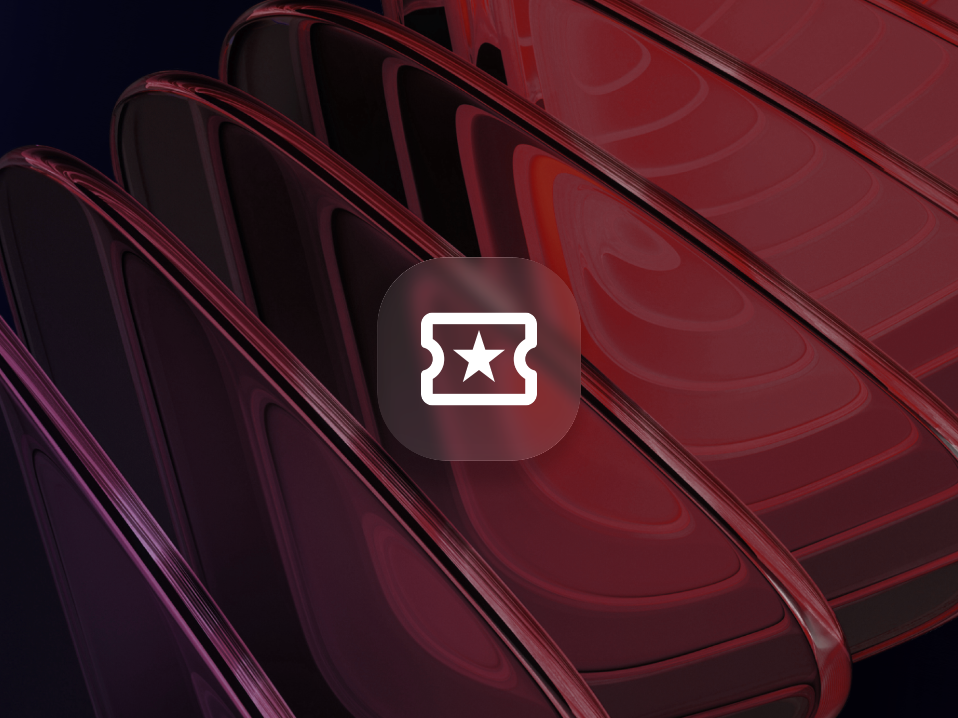Close-up of glossy red auditorium seats forming curved rows on a dark backdrop, overlaid with a rounded square icon showing a ticket and star, representing media and entertainment product metrics.